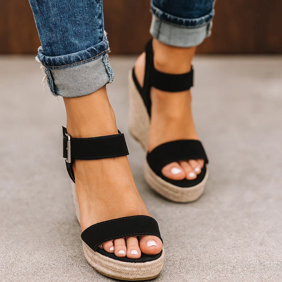 Side view of espadrille wedge sandal showing stacked sole and ankle strap