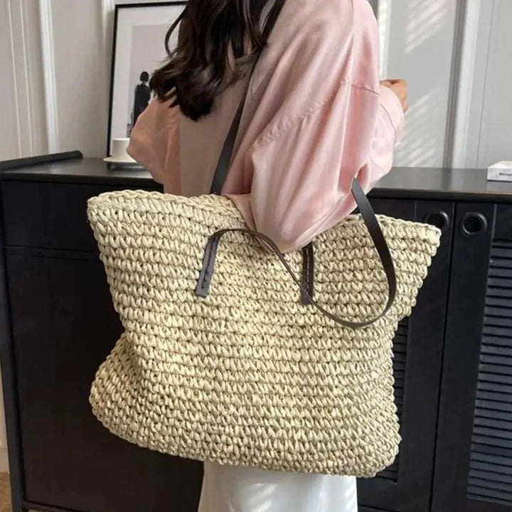 Straw tote bag showing crisscross weave texture close up