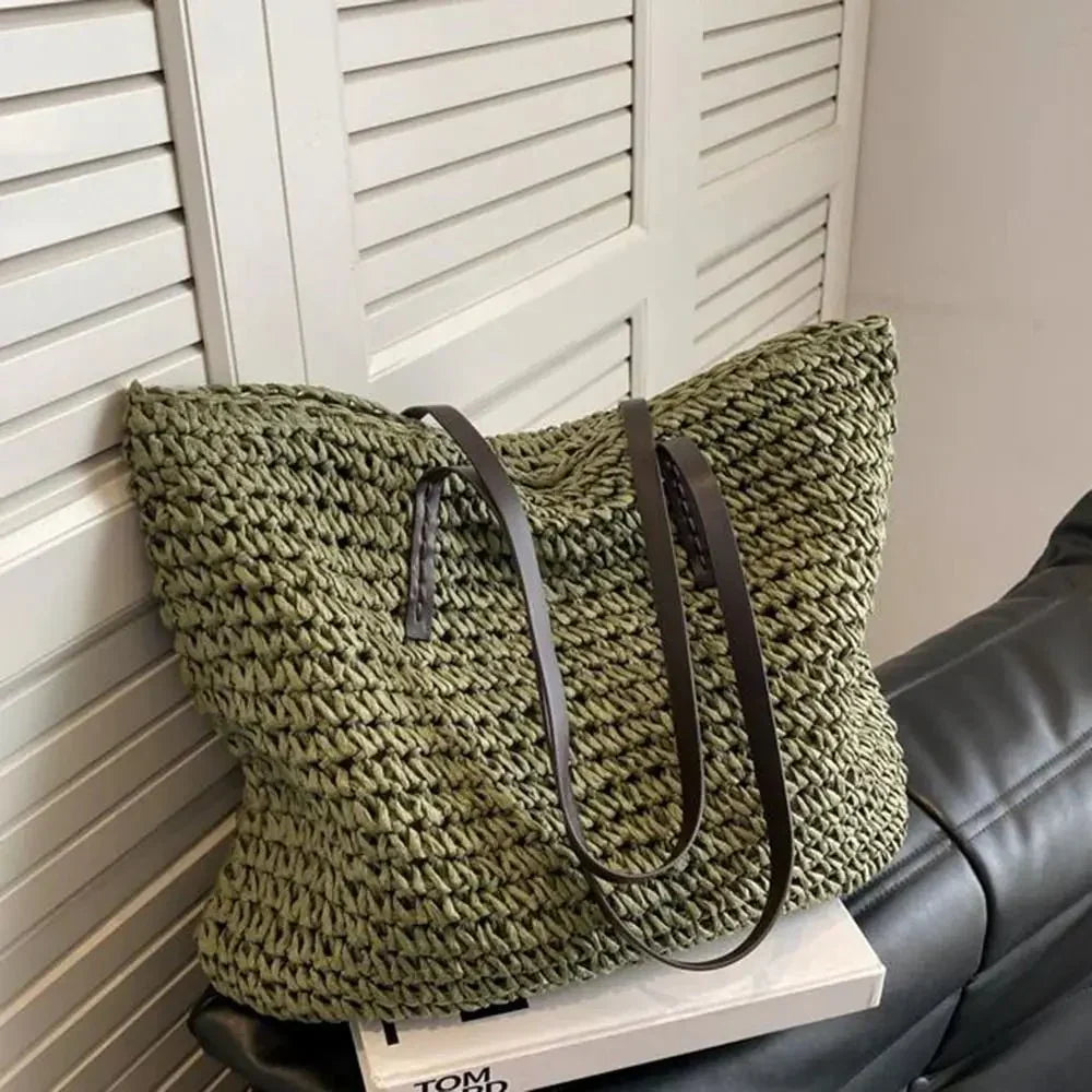 Side view of rectangular woven straw tote bag